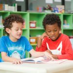 row-multiethnic-elementary-students-reading-book-classroom-vintage-effect-style-pictures_Easy-Resize.com